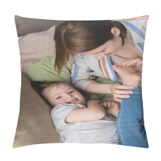 Personality  High Angle View Of Woman Touching Feet Of Child With Down Syndrome On Bed  Pillow Covers