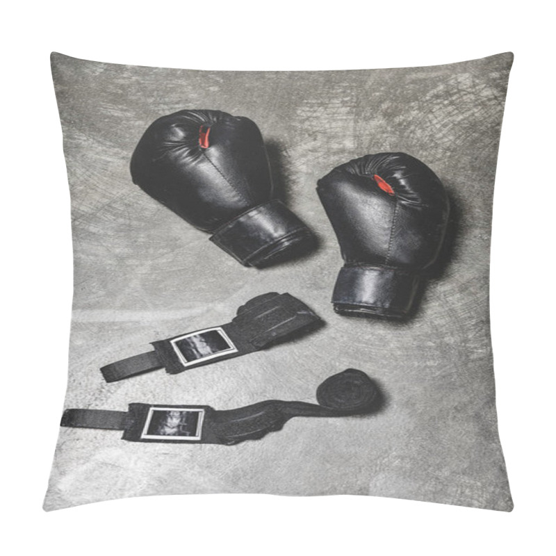 Personality  top view of boxing gloves with wrist wraps lying on concrete surface pillow covers