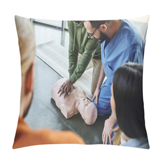 Personality  African American Man Practicing Chest Compressions And Cardiopulmonary Resuscitation On CPR Manikin Near Medical Instructor And Young Participants Of First Aid Seminar In Training Room Pillow Covers