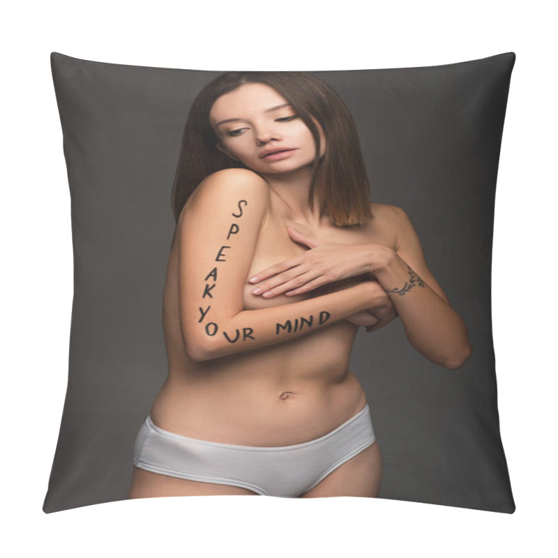 Personality  slim woman with speak your mind lettering on body covering breast with hands isolated on dark grey pillow covers