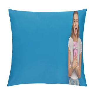 Personality  Excited Young Woman Holding Gift And Looking At Camera On Blue Background, Festive Occasions, Banner Pillow Covers