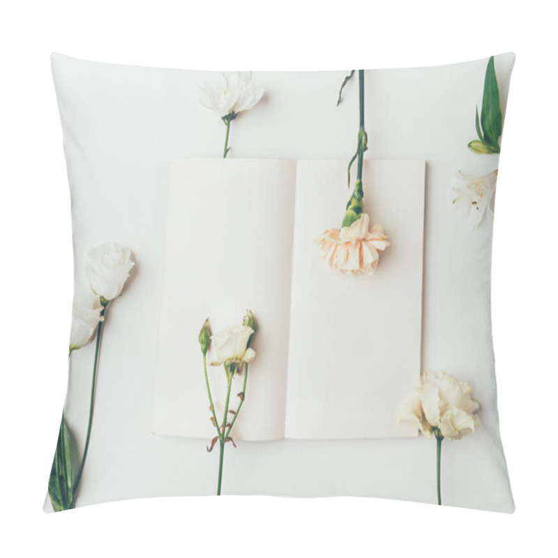 Personality  top view of fresh tender blooming flowers and blank card on grey  pillow covers