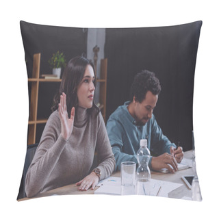 Personality  Young Businesswoman Raising Hand While Sitting Near African American Colleague At Business Meeting Pillow Covers