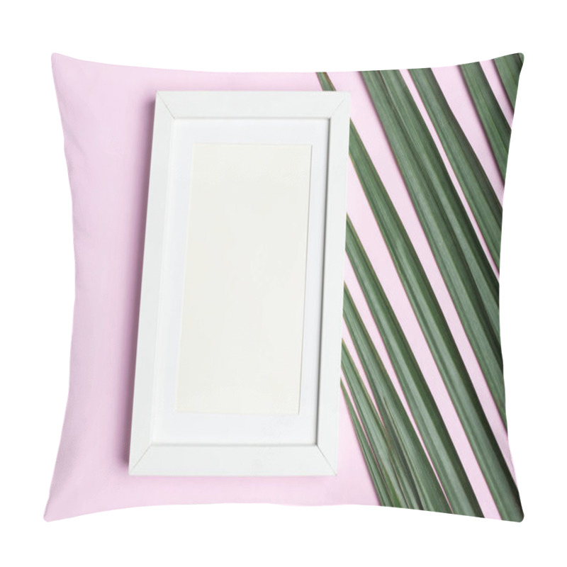 Personality  Top view blank white photo frame on green palm leaf on pastel pi pillow covers