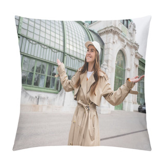 Personality  Happy Young Woman In Trench Coat And Baseball Cap Standing With Outstretched Hands On Rooftop Of European Building  Pillow Covers