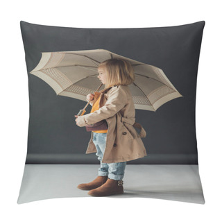 Personality  Side View Of Child In Trench Coat And Jeans Holding Umbrella On Black Background Pillow Covers