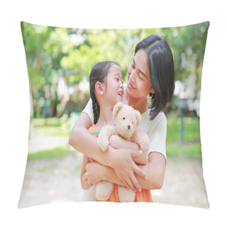 Personality  Portrait Of Happy Asian Mother Cuddle Daughter And Hugging Teddy Bear Doll In The Garden. Mom And Child Girl With Love And Relationship Concept. Pillow Covers