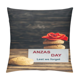 Personality  Card With Anzas Day Lettering Near Artificial Flower And Tasty Cookies On Wooden Surface  Pillow Covers