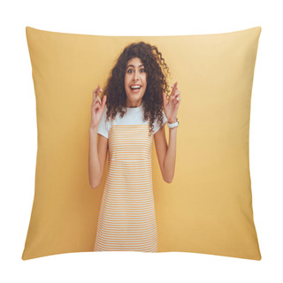 Personality  Excited Bi-racial Girl Holding Crossed Fingers While Smiling At Camera On Yellow Background Pillow Covers