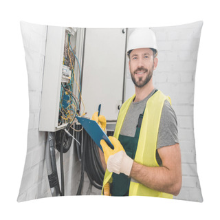 Personality  Smiling Handsome Electrician Holding Clipboard Near Electrical Box In Corridor And Looking At Camera Pillow Covers