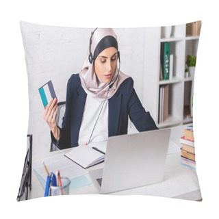 Personality  Arabian Interpreter In Headset Holding Digital Translator While Working On Laptop Near Dictionaries, Blurred Foreground Pillow Covers
