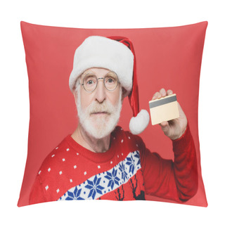 Personality  Senior Man In Sweater And Santa Hat Showing Credit Card Isolated On Red  Pillow Covers