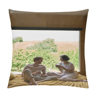 Personality  Happy Multiethnic Couple Holding Cups Of Coffee And Sitting On Bed Next To Window With Natural View Pillow Covers