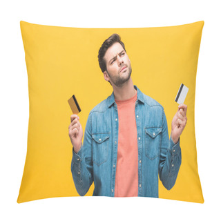 Personality  Confused Good-looking Man Holding Credit Cards Isolated On Yellow Pillow Covers