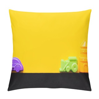 Personality  Top View Of Toy Tower Near Colorful Plastic Vehicles On Black And Yellow Background Pillow Covers