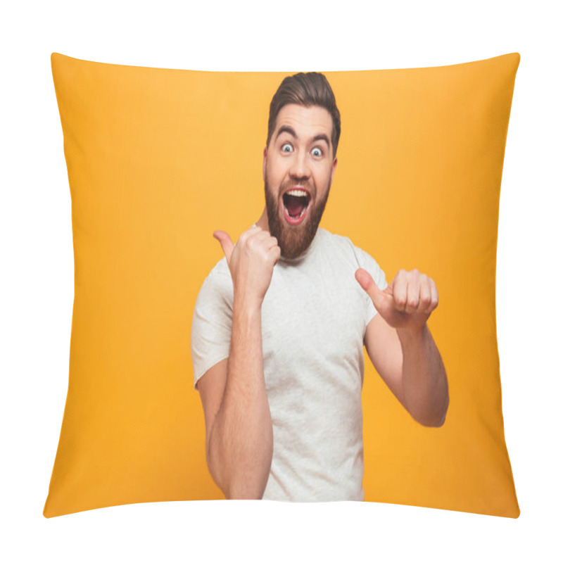 Personality  Portrait of a happy bearded man pointing pillow covers