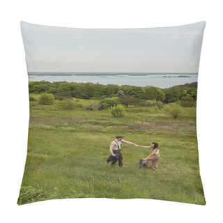 Personality  Side View Of Positive And Stylish Couple In Vintage Outfits Holding Hands And Standing On Grassy Hill With Rural Landscape At Background, Stylish Couple Enjoying Country Life Pillow Covers