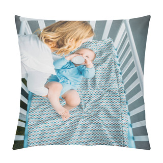 Personality  High Angle View Of Mother Putting Her Little Child Into Crib At Home Pillow Covers