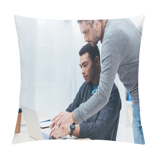 Personality  Bearded Mentor Helping Young Colleague Working With Laptop In Office Pillow Covers