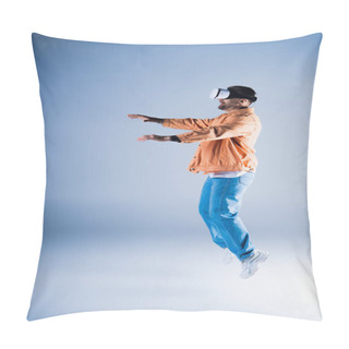 Personality  A Man In A VR Headset Jumps Energetically In A Studio Setting, Showcasing His Acrobatic Skills While Wearing A Stylish Hat. Pillow Covers