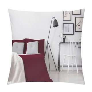 Personality  Teenager's Artistic Bedroom Interior With Framed Drawings Above A Make-up Table And A Comfortable Bed Dressed In Burgundy Linen And Quilted Gray Pillows. Real Photo. Pillow Covers