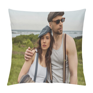 Personality  Stylish Man In Newsboy Cap And Sunglasses Hugging Brunette Girlfriend In Suspenders Holding Vest And Looking At Camera While Standing With Field At Background, Trendy Couple In The Rustic Outdoors Pillow Covers