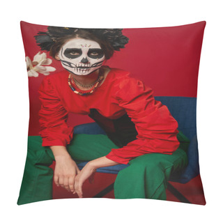 Personality  Woman In Dia De Los Muertos Makeup Sitting In Armchair Near Flowers And Looking At Camera On Red Pillow Covers