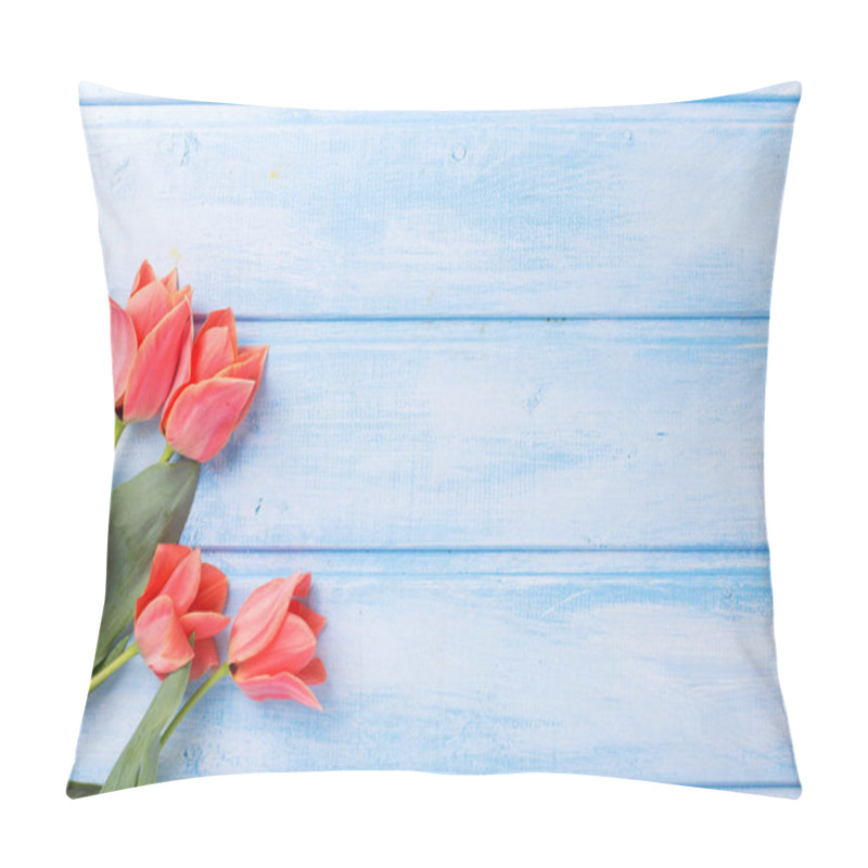 Personality  Coral tulips  on blue  painted wooden background. pillow covers