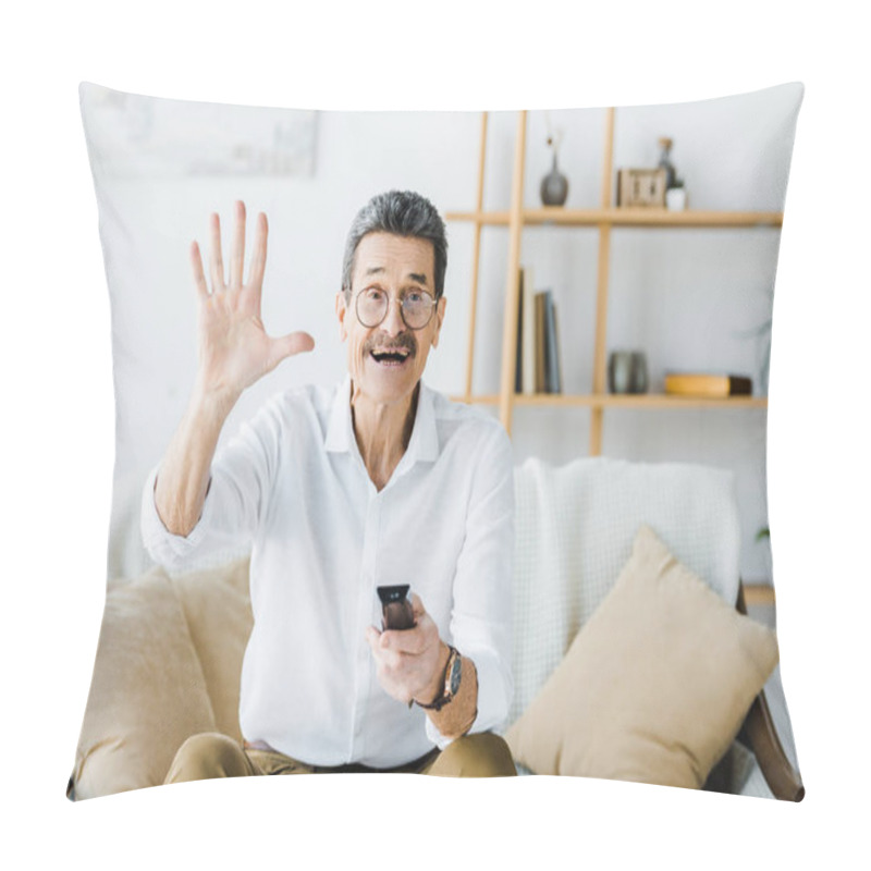 Personality  Cheerful Senior Man Sitting On Sofa And Holding Remote Control While Waving Hand Pillow Covers