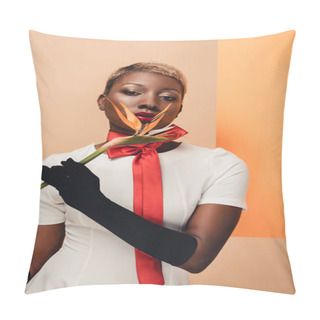 Personality  Attractive African American Woman In Black Gloves Posing With Strelitzia Flower On Beige And Orange Pillow Covers
