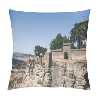 Personality  Scenic View Of Stone Wall, Palms And Building On Rock Against Mountains Landscape, Ronda, Spain Pillow Covers