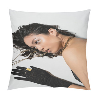 Personality  Overhead View Of Asian Model With Short Brunette Hair Holding Golden Jewelry In Mouth While Looking Away And Lying On Grey Background, Everyday Makeup, Wet Hairstyle, Young Woman, Black Gloves Pillow Covers