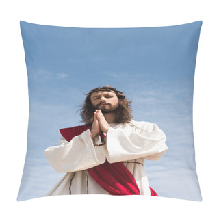 Personality  Low Angle View Of Jesus In Robe, Red Sash And Crown Of Thorns Holding Rosary And Praying With Closed Eyes Against Blue Sky Pillow Covers