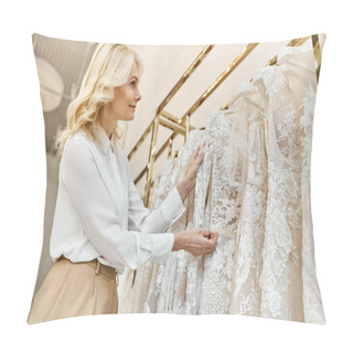 Personality  A Middle-aged Beautiful Shopping Assistant Helps A Woman Browse Through Wedding Dresses On A Rack In A Bridal Salon. Pillow Covers
