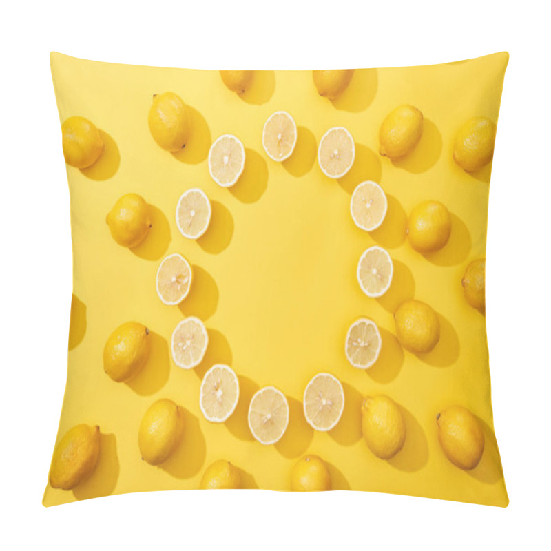 Personality  top view of ripe cut and whole lemons arranged in round frame on yellow background with copy space pillow covers