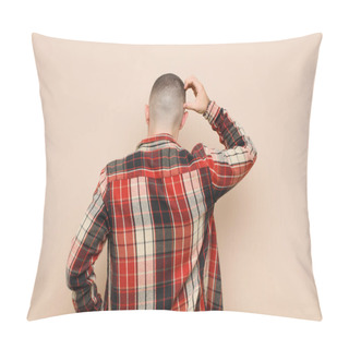 Personality  Young Handsome Man Feeling Clueless And Confused, Thinking A Solution, With Hand On Hip And Other On Head, Rear View Against Flat Wall Pillow Covers