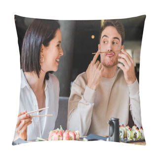Personality  Selective Focus Of Man Holding Chopsticks Near Face While Sitting With Cheerful Girl In Sushi Bar  Pillow Covers