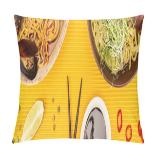 Personality  Top View Of Seafood And Meat Ramen Near Fresh Ingredients, Soy Sauce And Chopsticks On Yellow Surface, Panoramic Shot Pillow Covers