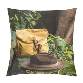 Personality  Close-up Shot Of Vintage Yellow Backpack And Straw Hat On Rock In Jungle Pillow Covers