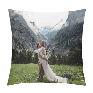 Personality  Happy Bride In Wedding Dress And Groom Embracing On Majestic Meadow With Mountains And Clouds In Alps Pillow Covers
