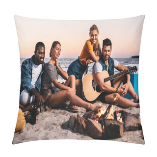 Personality  Happy Young Multiethnic Friends With Guitar Looking At Bonfire While Sitting Together On Sandy Beach Pillow Covers