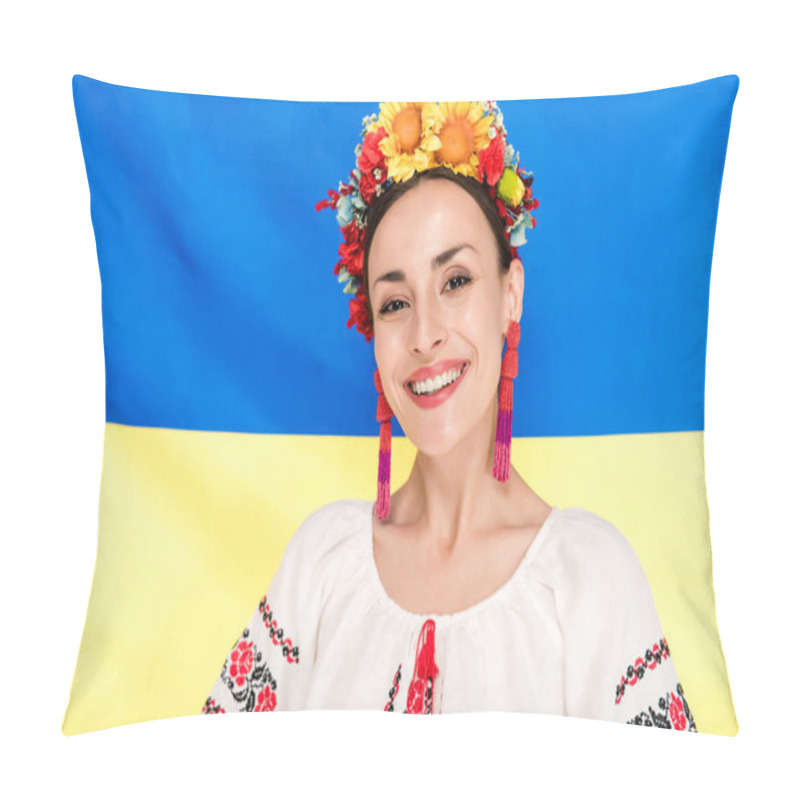 Personality  happy brunette young woman in national Ukrainian costume with flag of Ukraine on background pillow covers