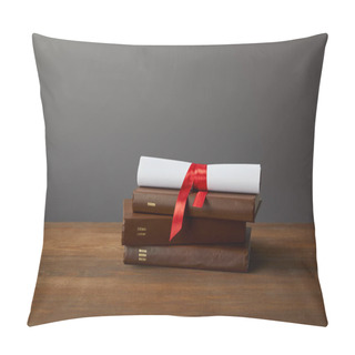 Personality  Brown Books And Diploma With Red Ribbon On Wooden Surface On Grey Pillow Covers