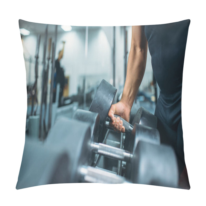 Personality  Male Athlete Takes Heavy Dumbbell In Hand, Gym Interior On Background. Weightlifting Workout In Sport Or Fitness Club, Weight Choosing Concept Pillow Covers