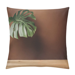 Personality  Exotic Tropical Monstera Leaf On Solid Wooden Table On Pastel Brown Wall. Creative Blog Or Social Media Background. Mock Up. Pillow Covers