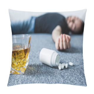 Personality  Selective Focus Of Unconscious Man Lying On Floor Near Glass Of Whiskey And Container With Pills  Pillow Covers