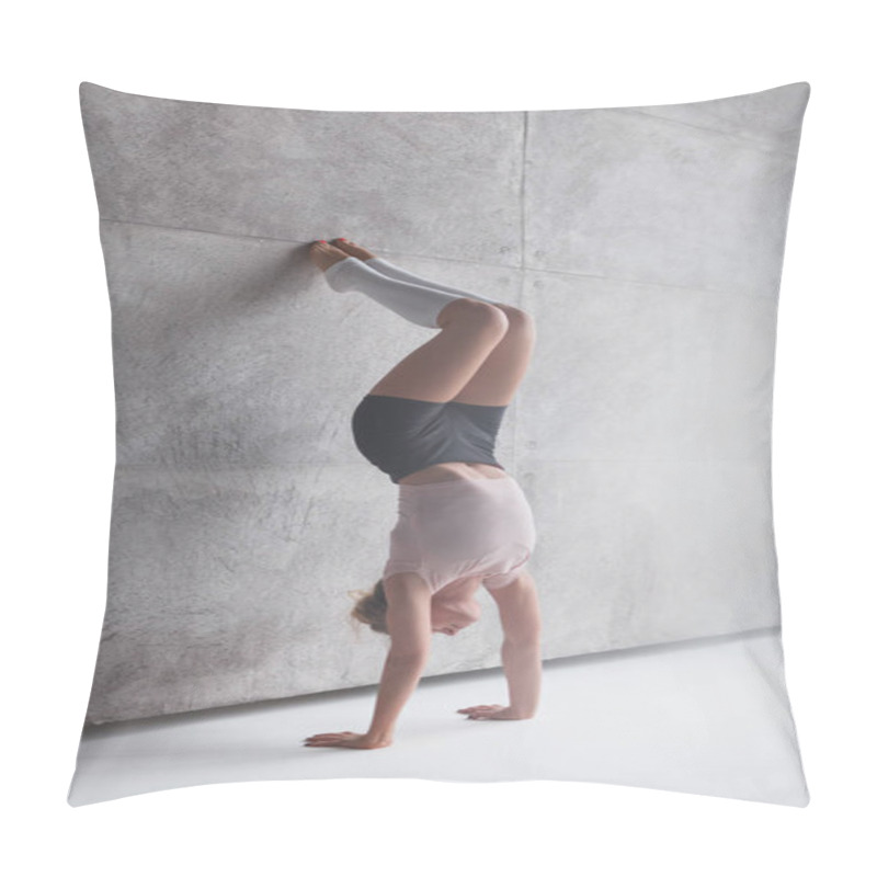 Personality  Slim woman in handstand against wall pillow covers