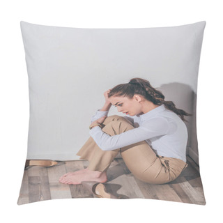 Personality  Sad Woman In White Blouse And Beige Pants Sitting On Floor Near Wall At Home, Grieving Disorder Concept Pillow Covers