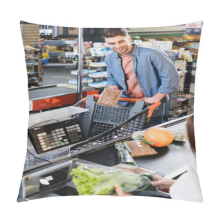Personality  Smiling Man Holding Package With Buckwheat Near Cashier On Supermarket Checkout Pillow Covers