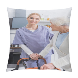 Personality  Smiling Nurse Looking At Camera Near Aged Woman With Medical Walkers Pillow Covers